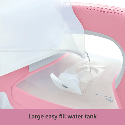The filler cup pouring water into the large 12.7 once water tank through the convenient side filling door.