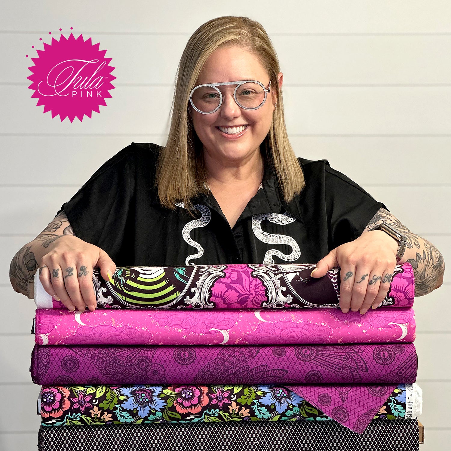 Tula Pink with a selection of he fabrics. Tula is an illustrator, a fabric designer, a quilter, an author, a maker and a generally good person.  For real deal up date info on Tula Pink, her Studio and projects follow her on Facebook and Instagram.