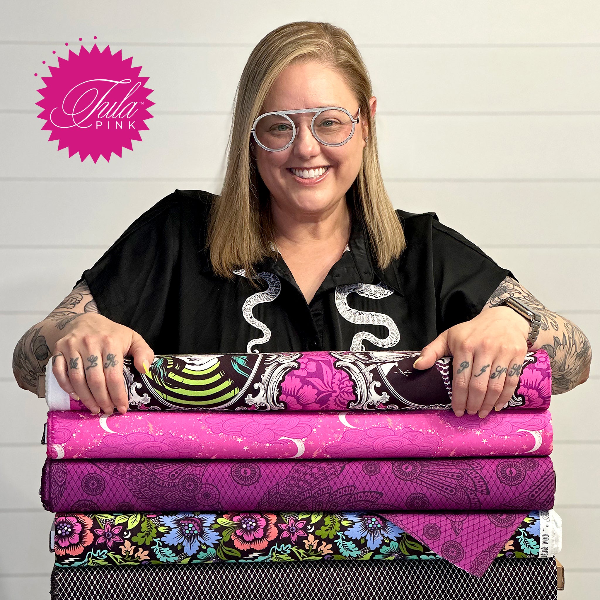 Tula Pink with a selection of he fabrics. Tula is an illustrator, a fabric designer, a quilter, an author, a maker and a generally good person. For real deal up date info on Tula Pink, her Studio and projects follow her on Facebook and Instagram.