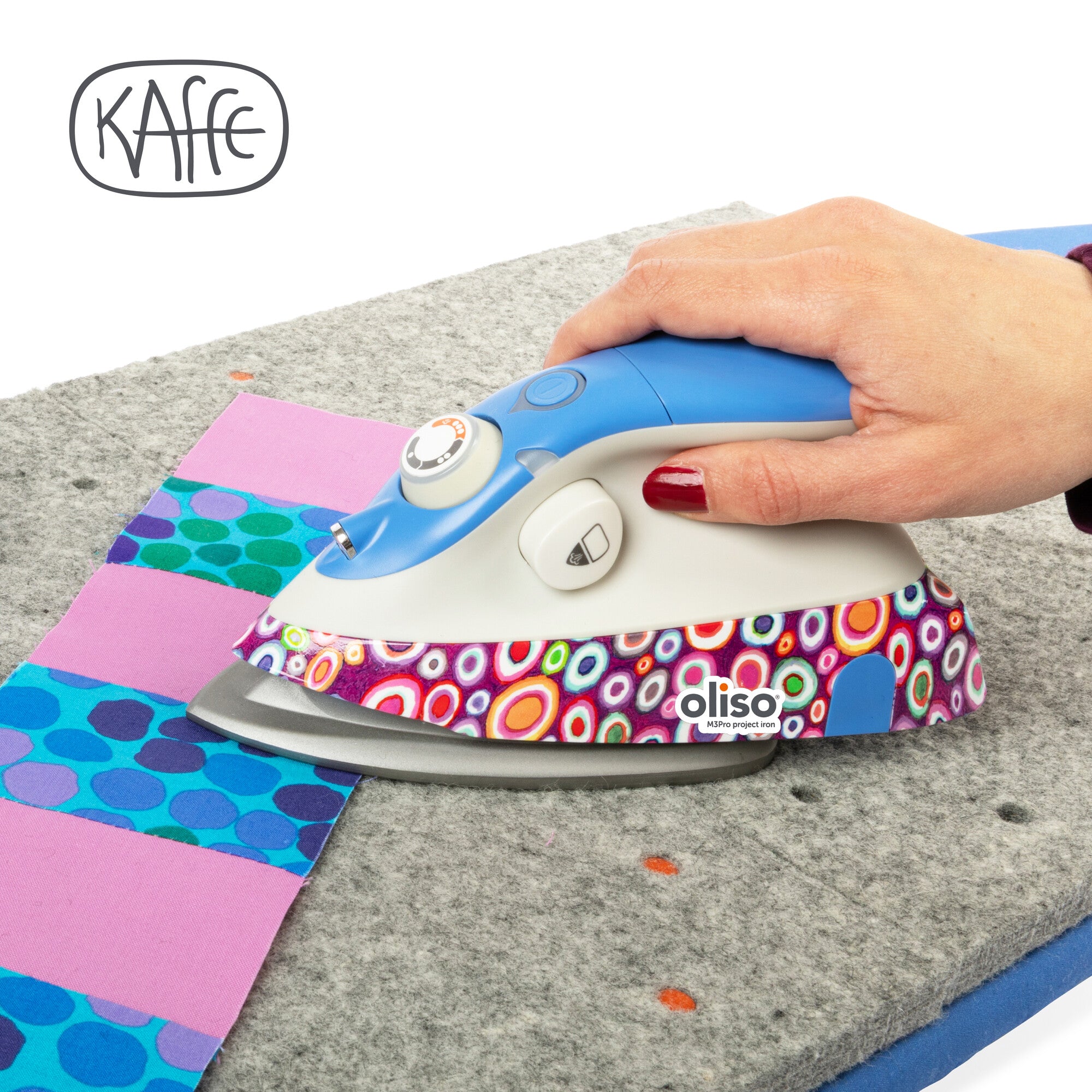 The Kaffe x Oliso M3Pro project Iron, featuring vibrant Kaffe Fassett signature patterns, specifically designed with quilting and sewing in mind.