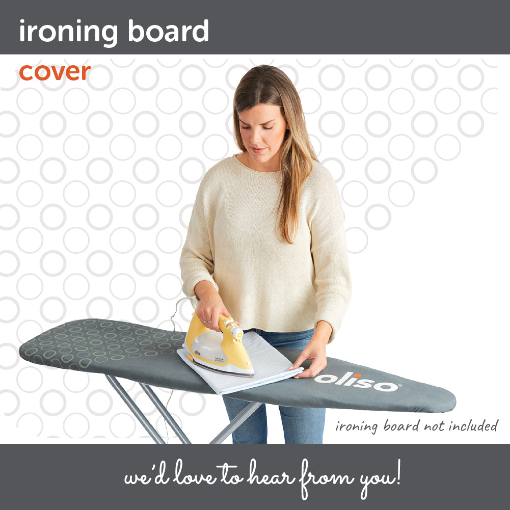 A person pressing fabric with an iron on the grey Oliso Ironing board cover.