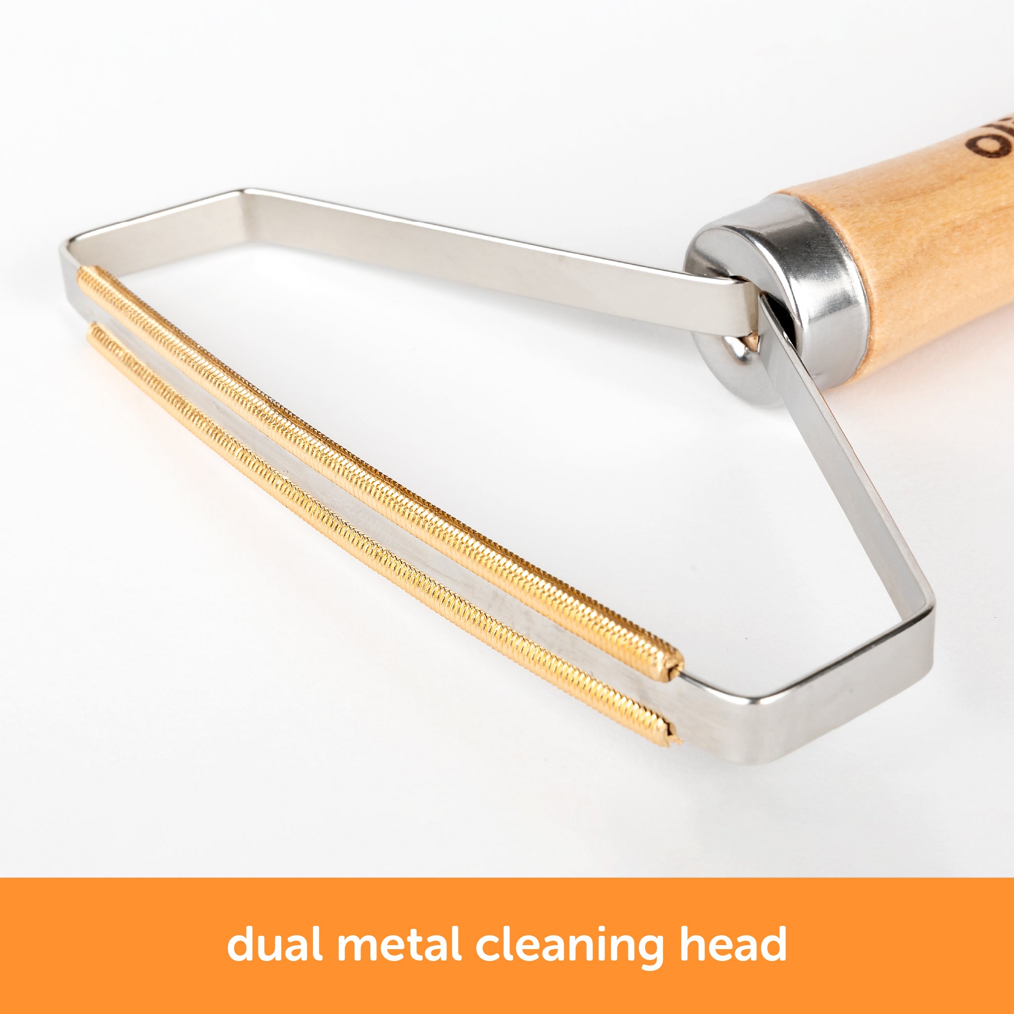 Close-up of Oliso MultiMat cleaning tool’s dual metal comb head designed to remove lint, pet hair, and fibers from wool pressing mats.