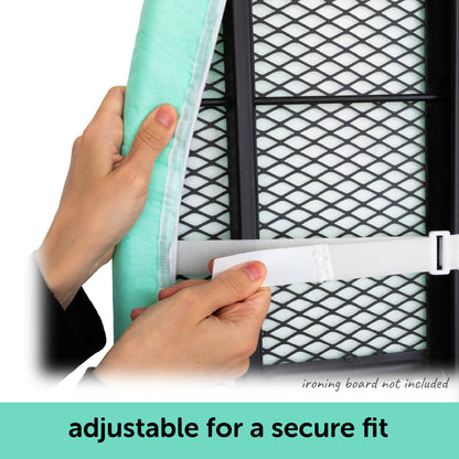 Hands showing how the hook and loop fastener straps adjust the oliso ironing board cover for a tight, secure fit on a standard ironing board.
