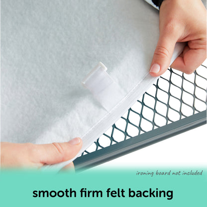 Person showing the smooth, firm felt backing of an oliso ironing board cover. With text indicating that the ironing board is not included with the cover.