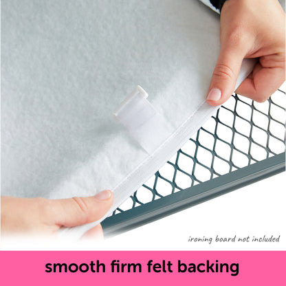 Person showing the smooth firm felt backing of an oliso ironing board cover. With text indicating that the an ironing board is not included with the cover.