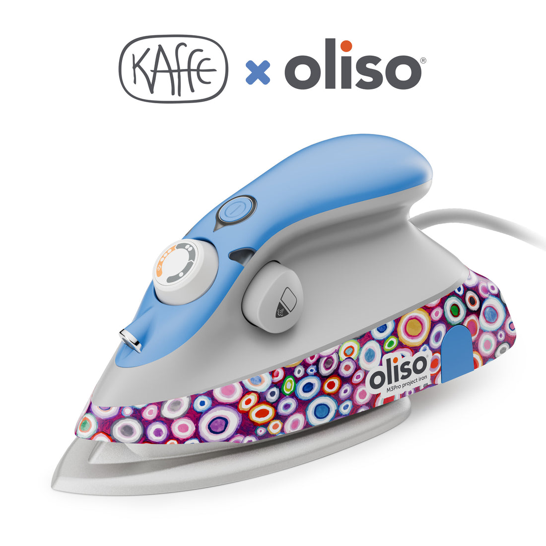Close-up of thelimited edition Kaffe x Oliso M3Pro Smart Iron, featuring vibrant Kaffe Fassett signature patterns on the body, with a sleek ceramic soleplate, illuminated by ProLight™ for precise fabric pressing