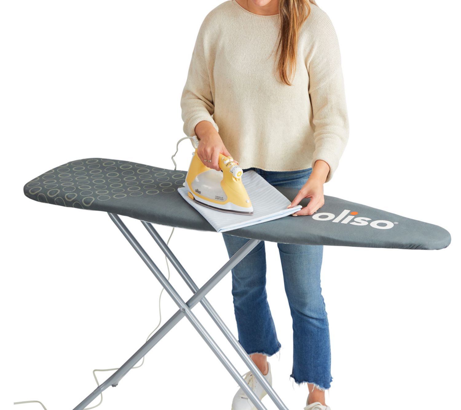 Clothes being ironed on a grey Oliso ironing board cover 