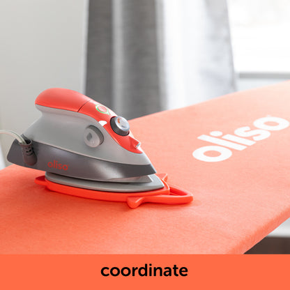 Image showing how the coral oliso M3Pro project iron contrast with the coral ironing board cover. Each is sold separately.