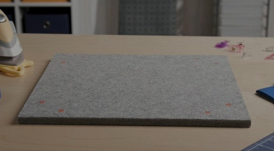 Content description: &quot;Watch a full demonstration of the Oliso MultiMat Wool Pressing Mat – featuring heat retention, joining and extension design, and portability for quilters and sewists.&quot;&gt;