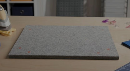 Content description: &quot;Watch a full demonstration of the Oliso MultiMat Wool Pressing Mat – featuring heat retention, joining and extension design, and portability for quilters and sewists.&quot;&gt;