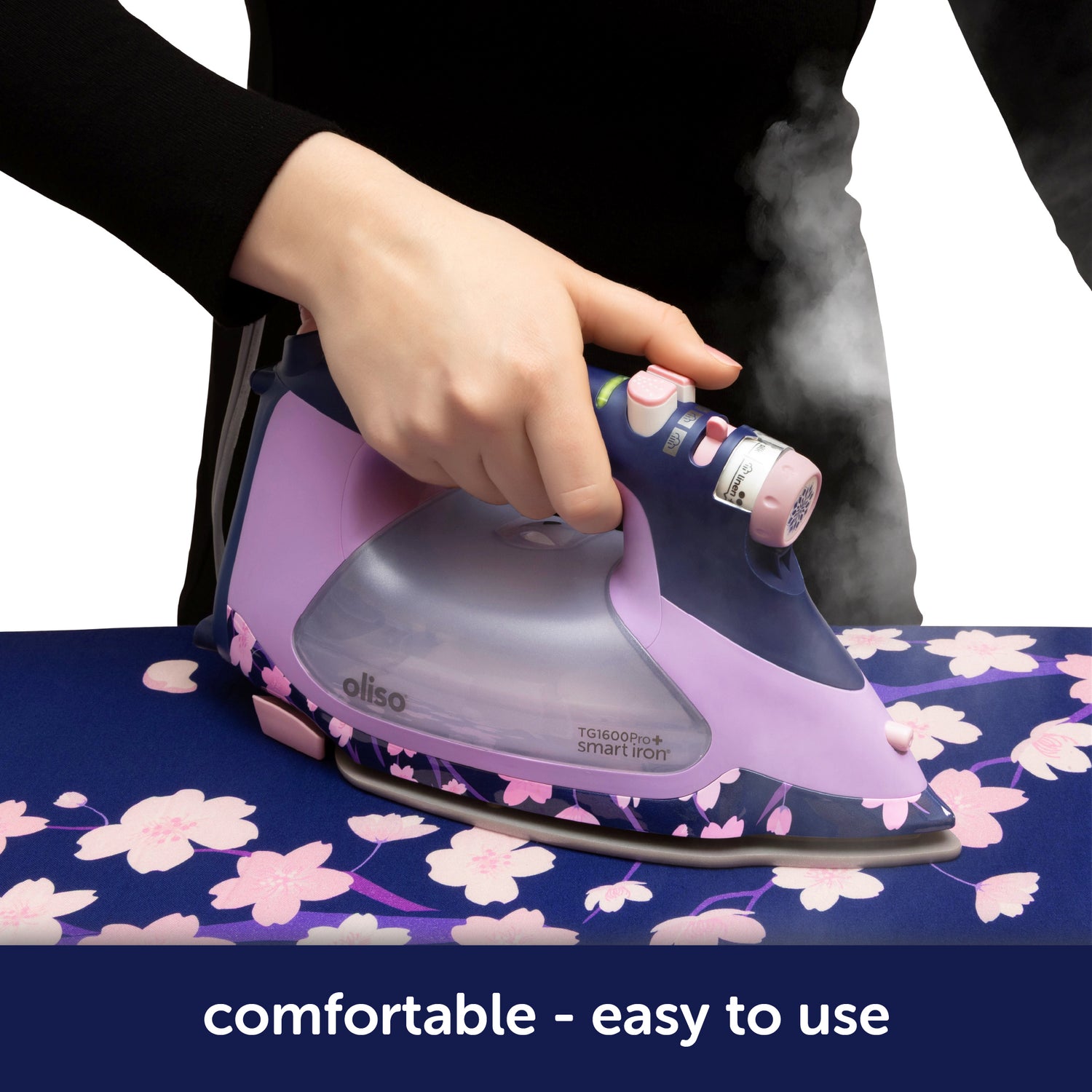 Oliso Yaya Han ProPlus Iron in striking midnight blue with a cherry blossom design. The ergonomic handle offers a comfortable grip, while the auto-lift feature eliminates the need to lift the iron—making pressing safer and less tiring. Perfect for sewing, quilting, and creating cosplay costumes.