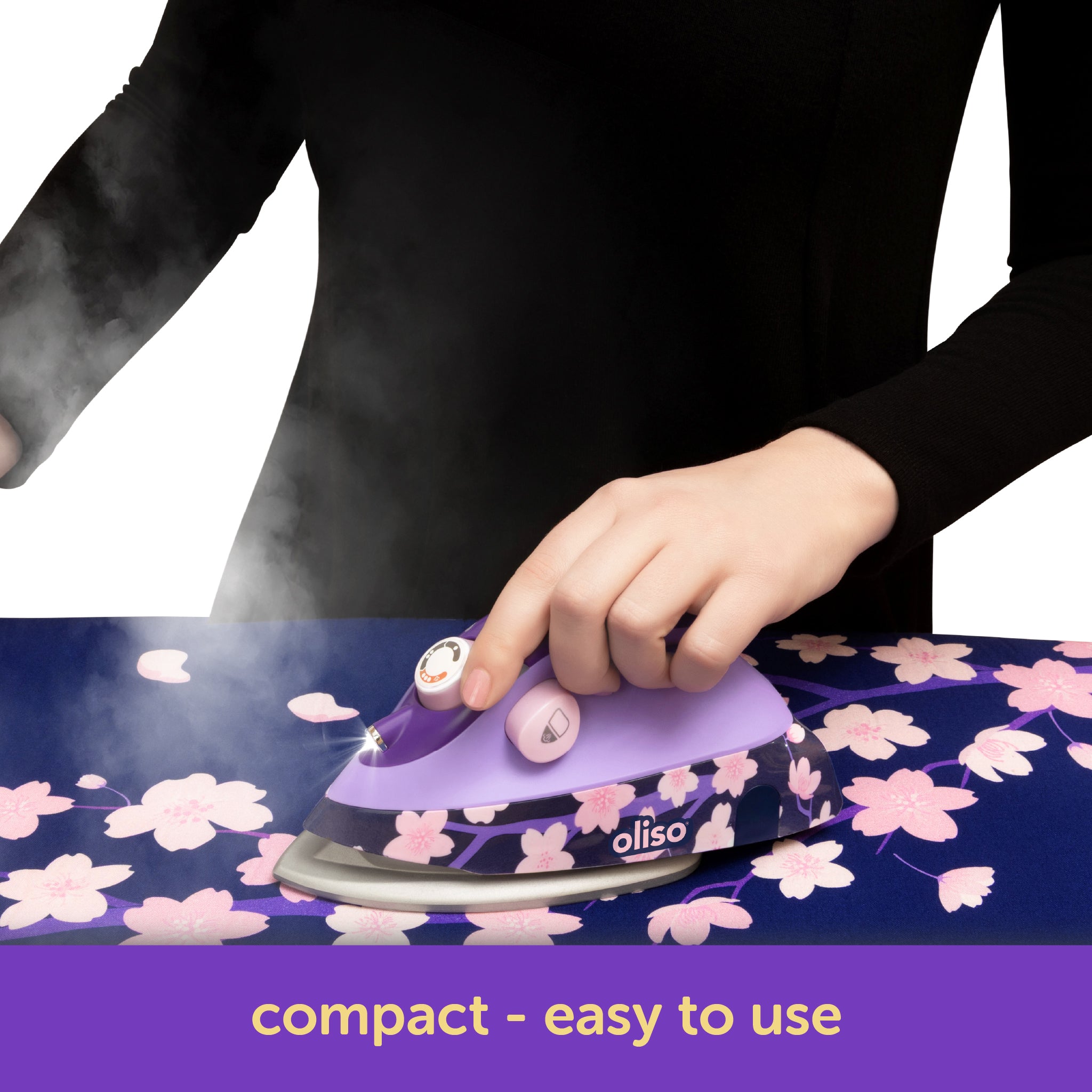 Oliso Yaya Han M3Pro project iron in Midnight Orchid with cherry blossom design, featuring an ergonomic mouse-style handle for easy grip and smooth gliding over fabric—perfect for sewing, quilting, and cosplay costume making.