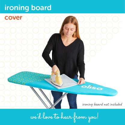 A person pressing fabric with an iron on the turquoise and yellow Oliso Ironing board cover.