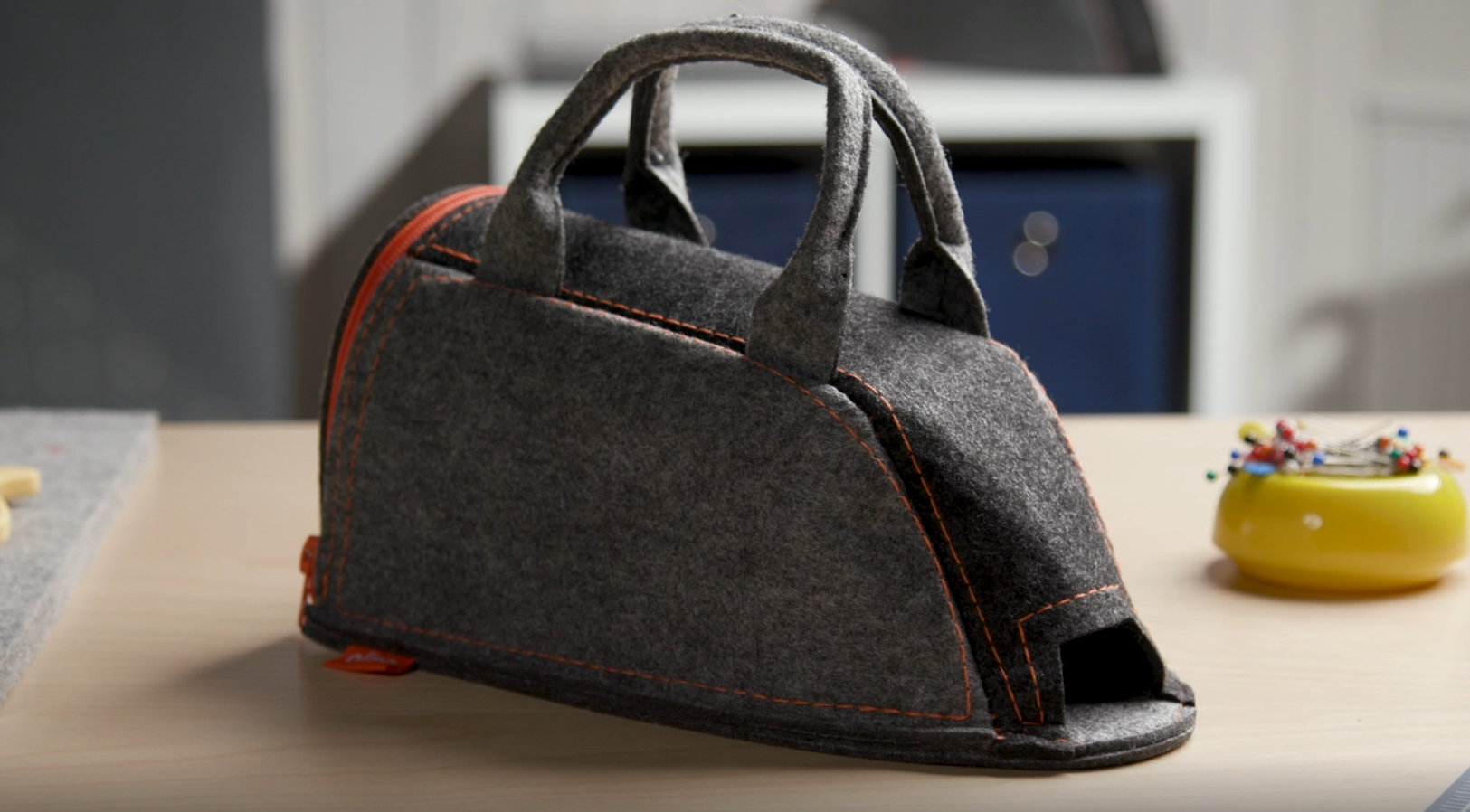 Video showing the details of the small Oliso iron carry bag. The felt bag provides stylish protection for your favorite iron. Practical design with  large zippered opening and front opening for the M2Pro SoleMate, iron sold separately. Click to play.