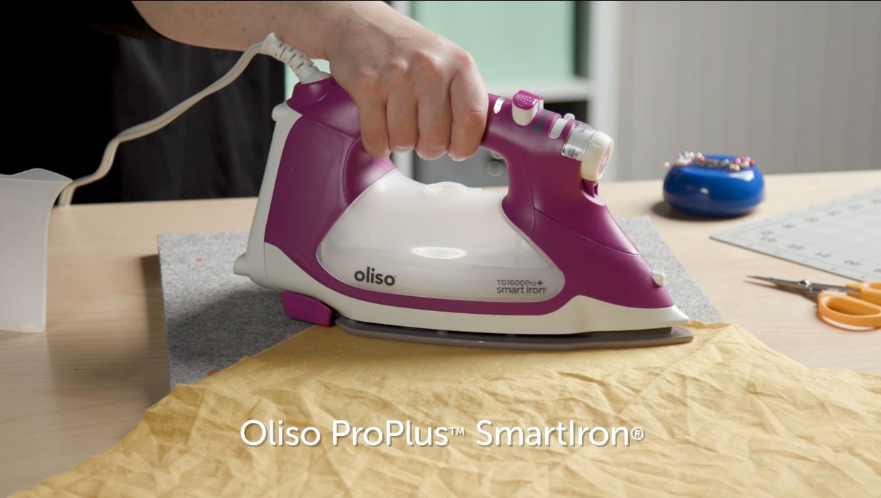 Video shows function of auto-lift iron. Simply touch the handle, and the iron lowers, ready to work. Take your hand off and the iron lifts, preventing scorches, burns, and tipping. It’s not only safer, but also saves time as well as your wrists!