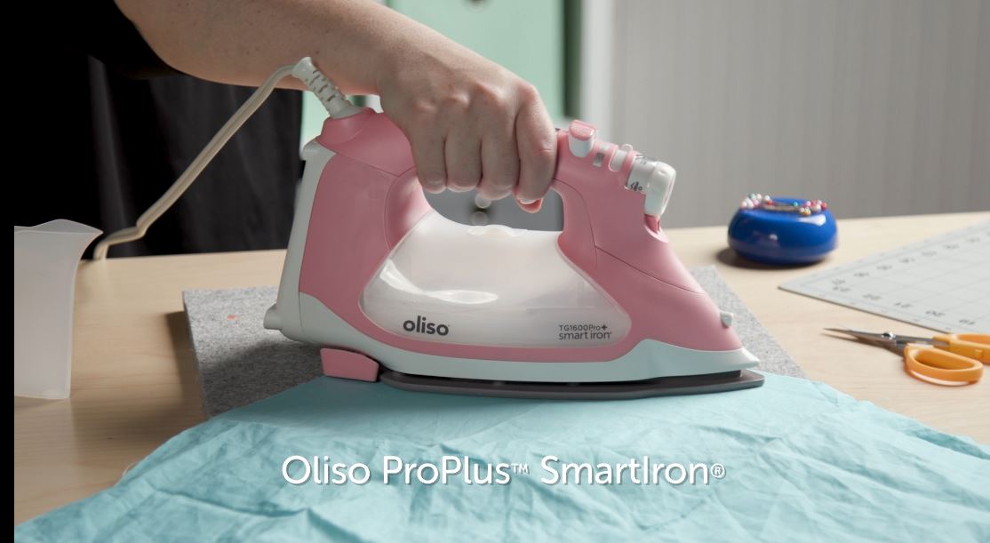 Video shows function of auto-lift iron. Simply touch the handle, and the iron lowers, ready to work. Take your hand off and the iron lifts, preventing scorches, burns, and tipping. It’s not only safer, but also saves time as well as your wrists!