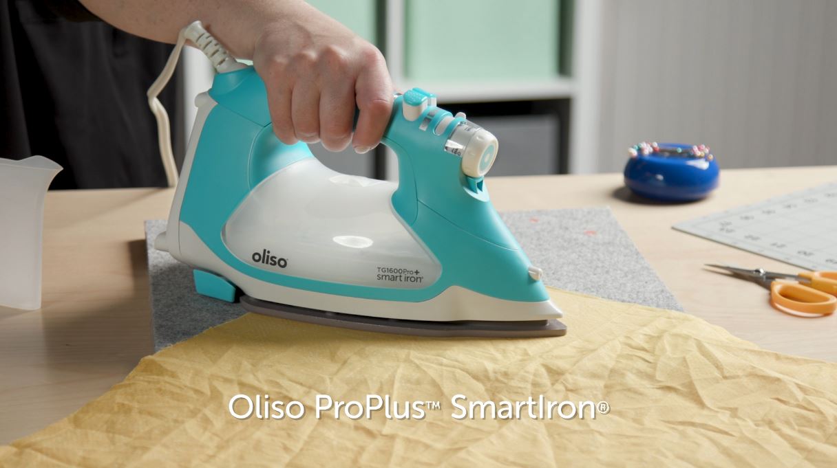 Video shows function of auto-lift iron. Simply touch the handle, and the iron lowers, ready to work. Take your hand off and the iron lifts, preventing scorches, burns, and tipping. It’s not only safer, but also saves time as well as your wrists!